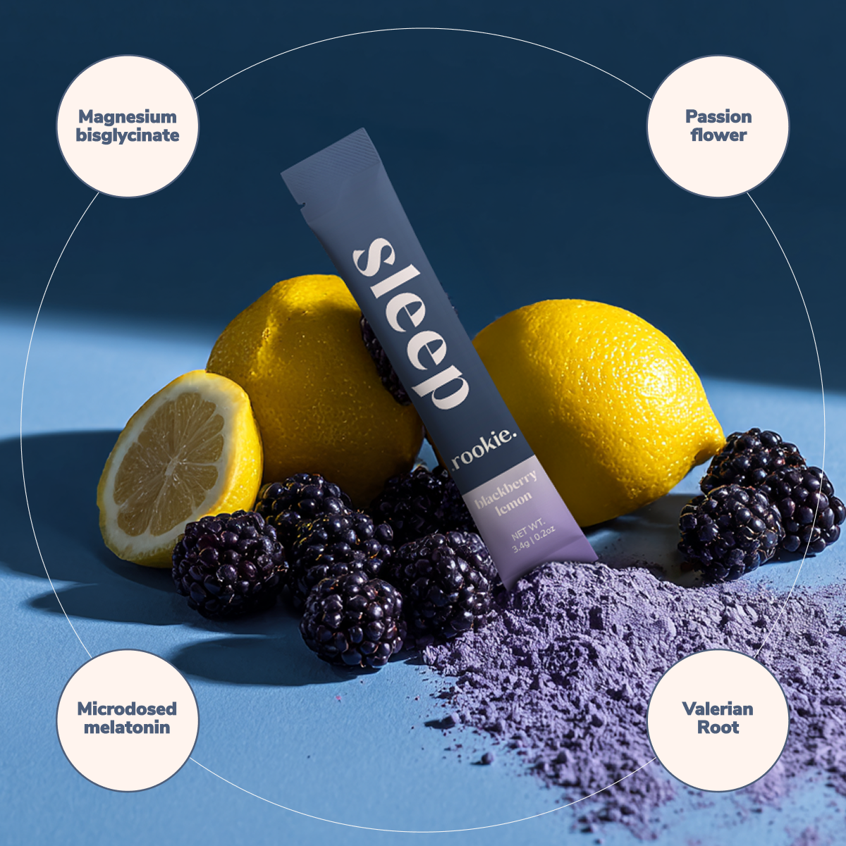 Sleep supplement with lemons, blackberries, and purple powder on a blue background