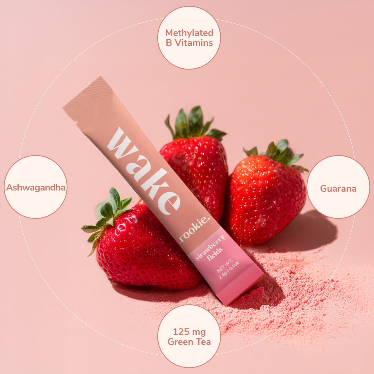 Cookie Wake supplement stick with strawberries on a pink background