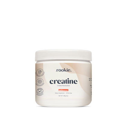 White plastic jar labeled "rookie creatine" unflavored powder with white lid and certification badges on side.