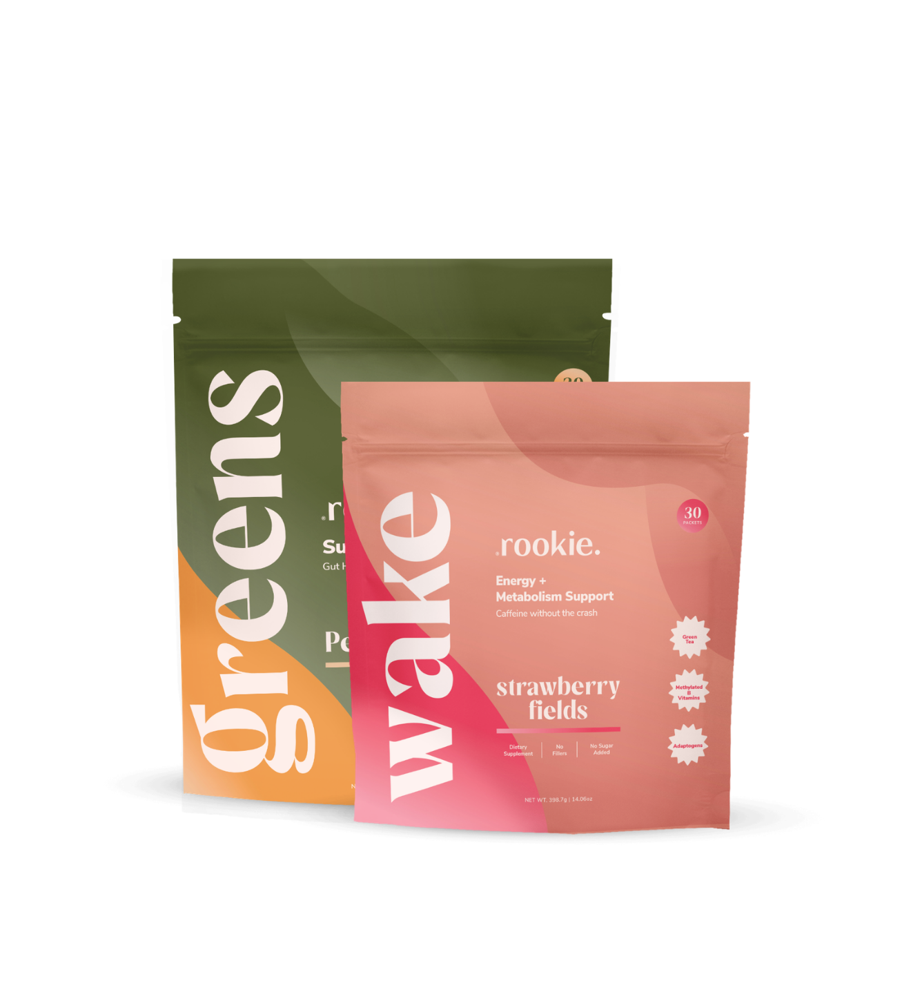 Two supplement packages labeled 'greens' and 'wake' on a white background