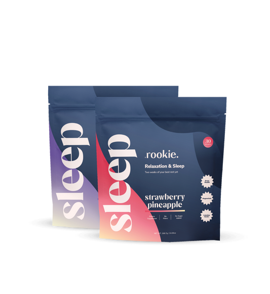 Two packages of 'rookie.' sleep aid with a strawberry pineapple flavor on a white background.